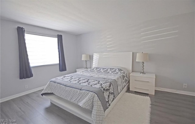 bedroom featuring dark hardwood / wood-style floors