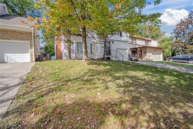 view of front facade with a front lawn and a garage