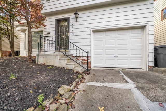 doorway to property featuring a garage