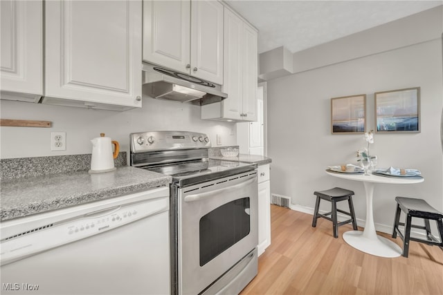 kitchen with electric range, dishwasher, white cabinets, and light hardwood / wood-style flooring