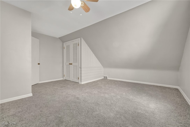 additional living space with carpet, ceiling fan, and lofted ceiling