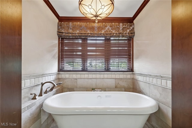 bathroom featuring ornamental molding, tile walls, and a tub to relax in