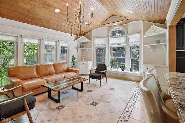 sunroom / solarium with a notable chandelier, a healthy amount of sunlight, lofted ceiling, and wood ceiling