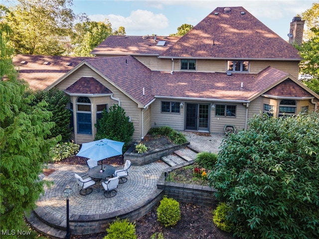 back of house with a patio area