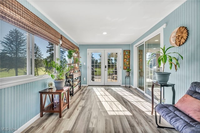 sunroom / solarium with plenty of natural light and french doors