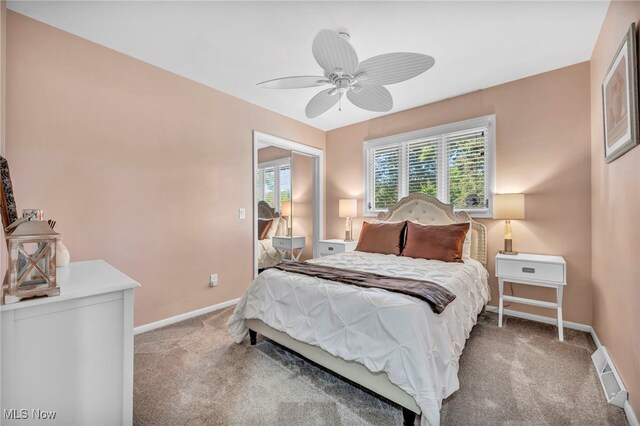 bedroom with ceiling fan and carpet flooring