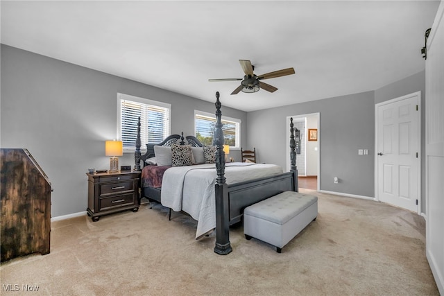 bedroom with light colored carpet and ceiling fan