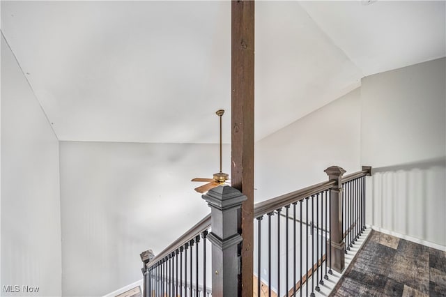 stairs with vaulted ceiling