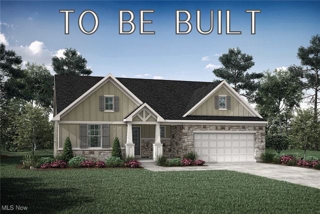 view of front of property with a front yard and a garage