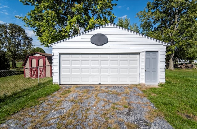 garage featuring a yard