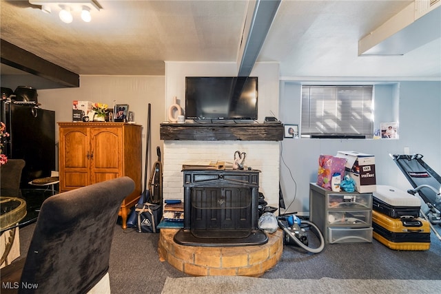 living room featuring beam ceiling and carpet flooring