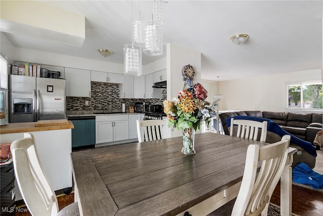 dining room with dark hardwood / wood-style floors