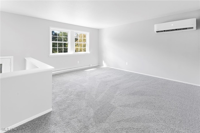 empty room with an AC wall unit, carpet flooring, and baseboard heating