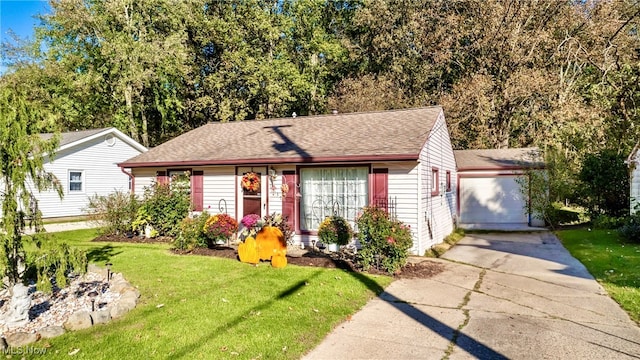 view of front of house featuring a garage and a front lawn