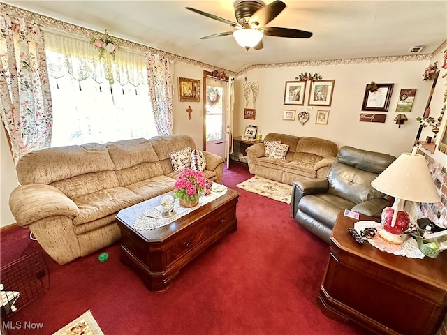 carpeted living room with ceiling fan