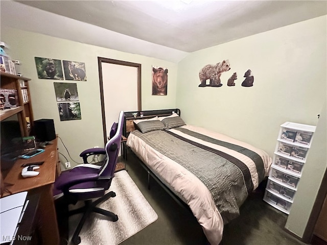 bedroom featuring vaulted ceiling