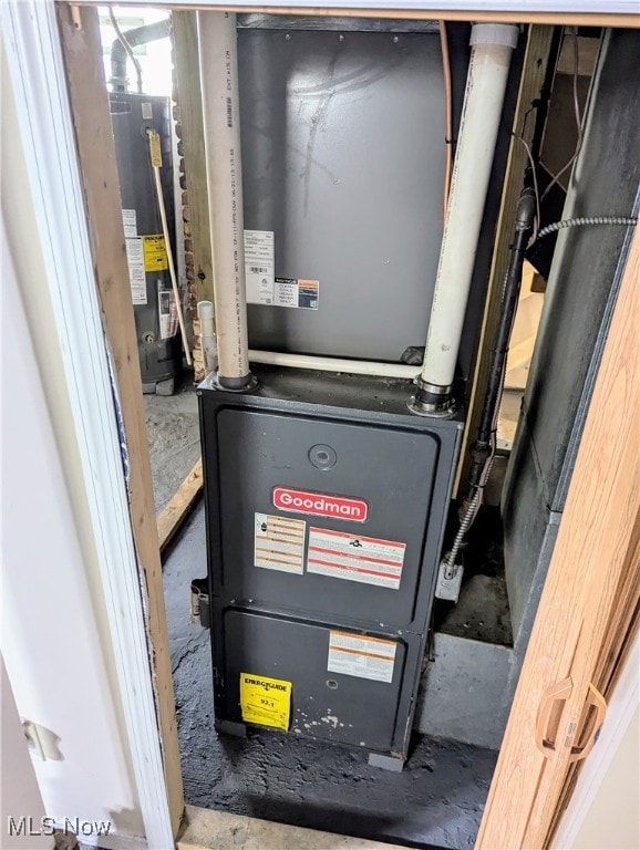 utility room with water heater