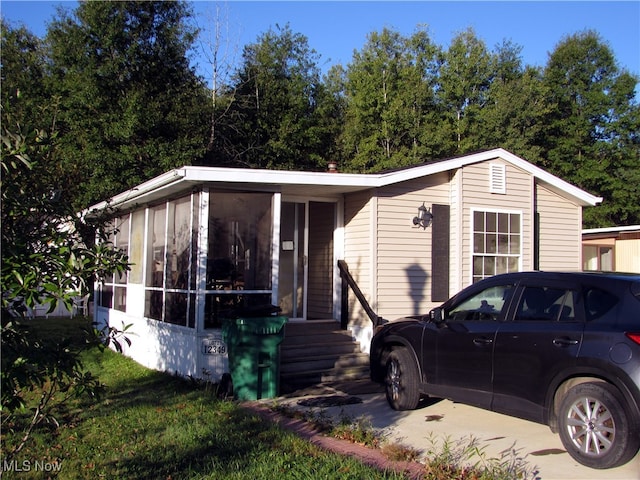 view of front of property with a sunroom