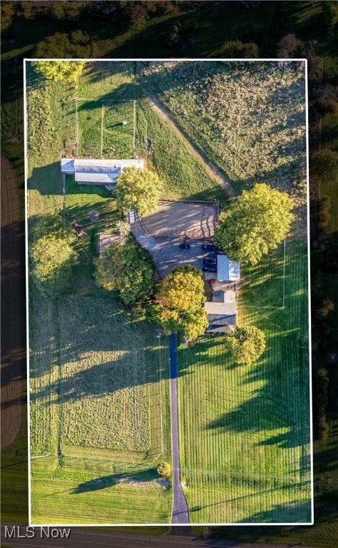 birds eye view of property with a rural view