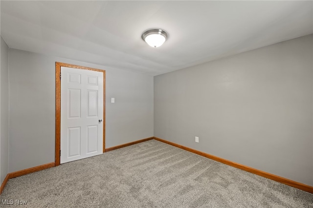 empty room featuring carpet flooring