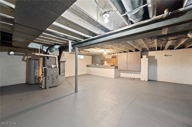 basement with gas water heater and heating unit