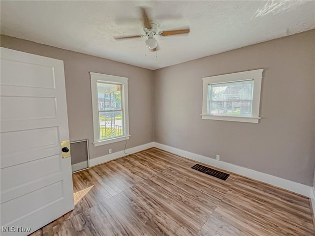 1504 W 19th St, Lorain, OH 44052 - empty room featuring ceiling fan and wood finished floors