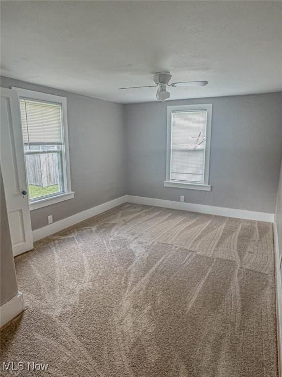 1504 W 19th St, Lorain, OH 44052 - carpeted empty room featuring baseboards and ceiling fan
