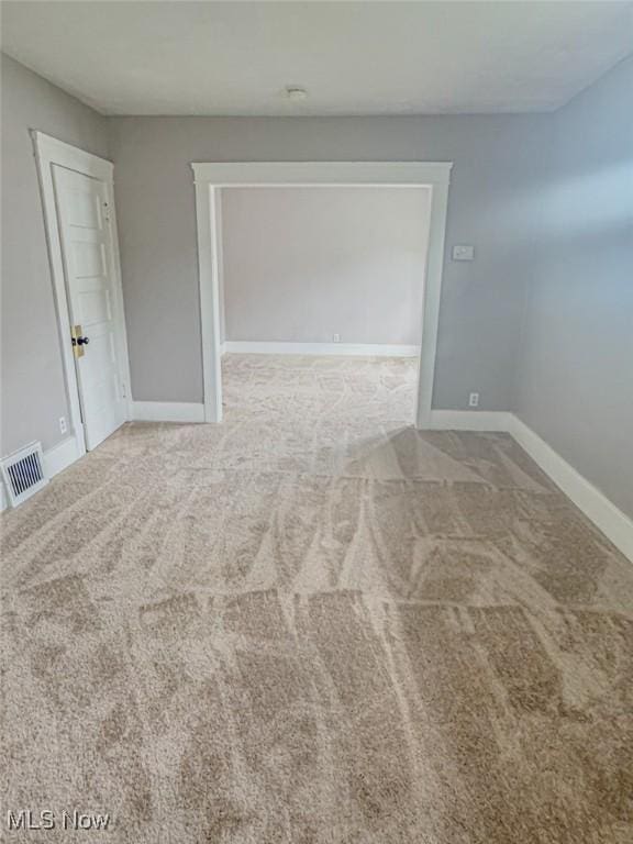 1504 W 19th St, Lorain, OH 44052 - empty room featuring carpet flooring and baseboards