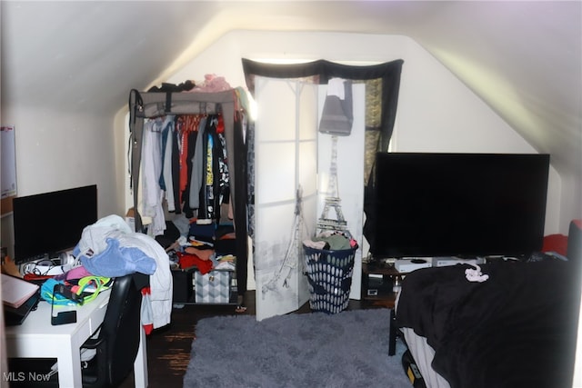 bedroom with lofted ceiling