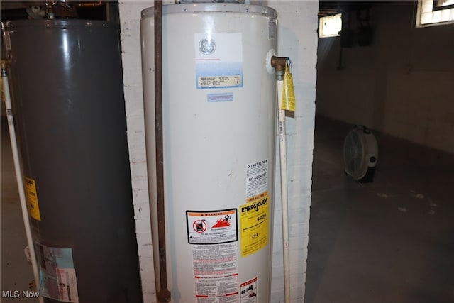 utility room featuring water heater