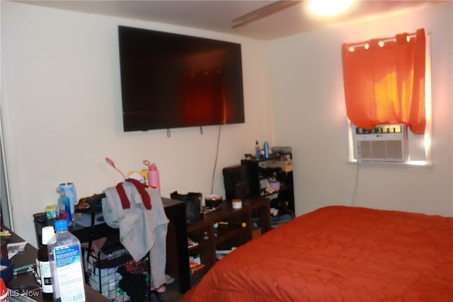 bedroom featuring ceiling fan and cooling unit