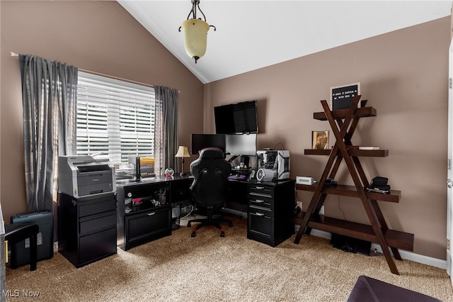 office space featuring light colored carpet and vaulted ceiling