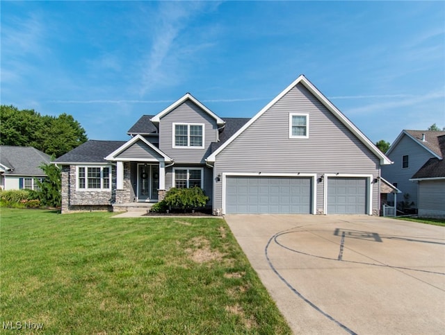 view of front of house featuring a garage and a front lawn