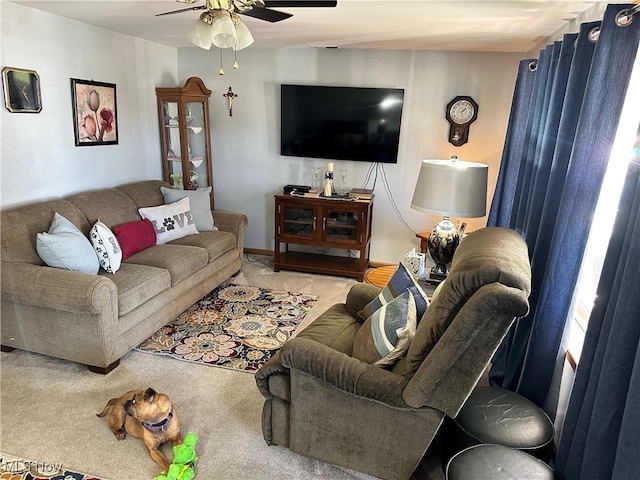 carpeted living room featuring ceiling fan