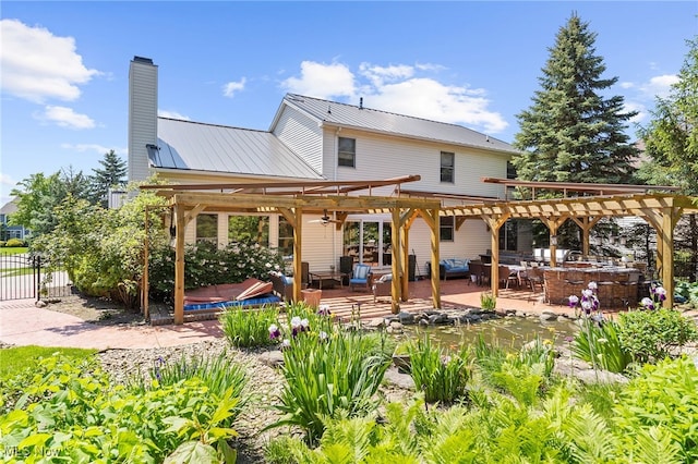 rear view of property with an outdoor living space, a pergola, and a patio area