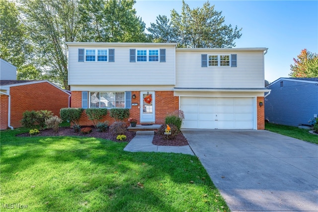 view of front of home with a garage and a front yard