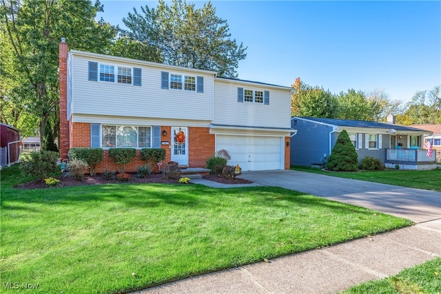 view of front of home with a garage and a front yard