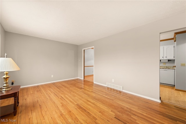 unfurnished room featuring light hardwood / wood-style flooring