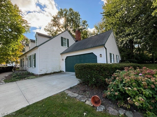 view of side of property featuring a garage