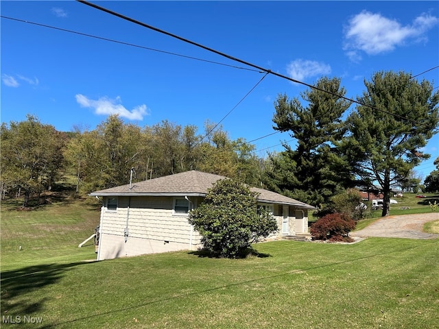 view of home's exterior featuring a lawn