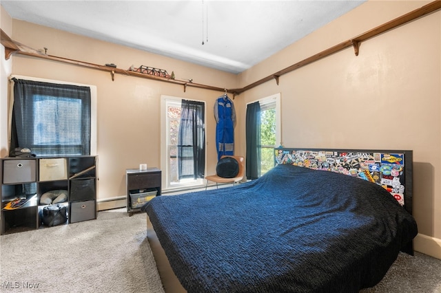 bedroom featuring carpet and a baseboard radiator