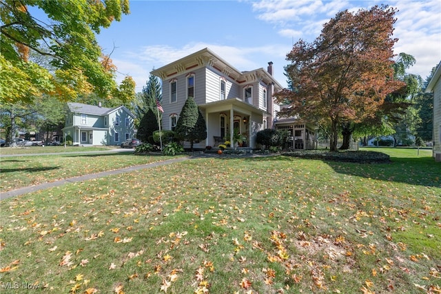 italianate-style house with a front yard