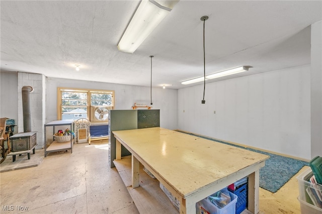 basement featuring a wood stove