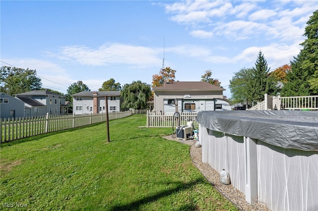 view of yard featuring a covered pool