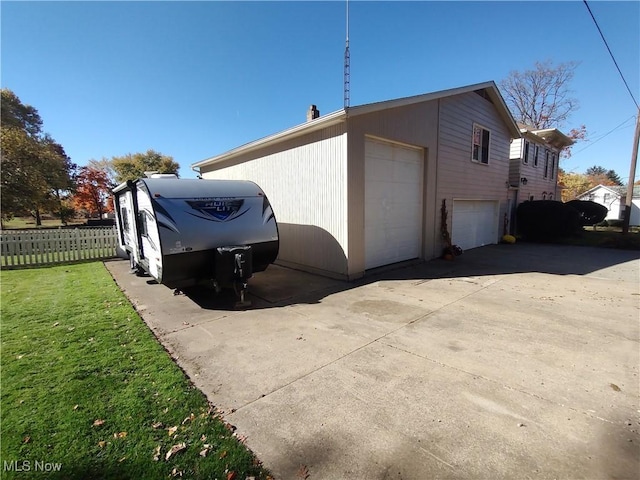 view of side of home featuring a garage