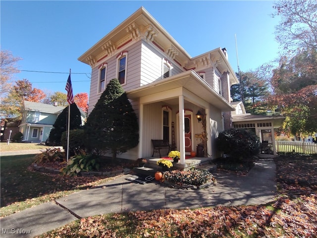 italianate-style house with covered porch