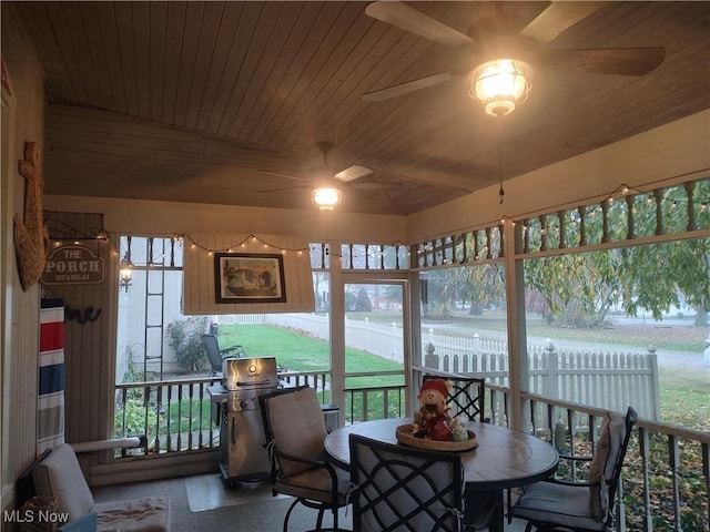 sunroom featuring wood ceiling