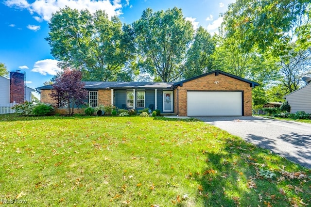 single story home with a front lawn and a garage