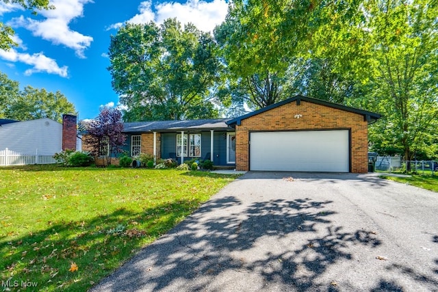 ranch-style house with a front yard and a garage