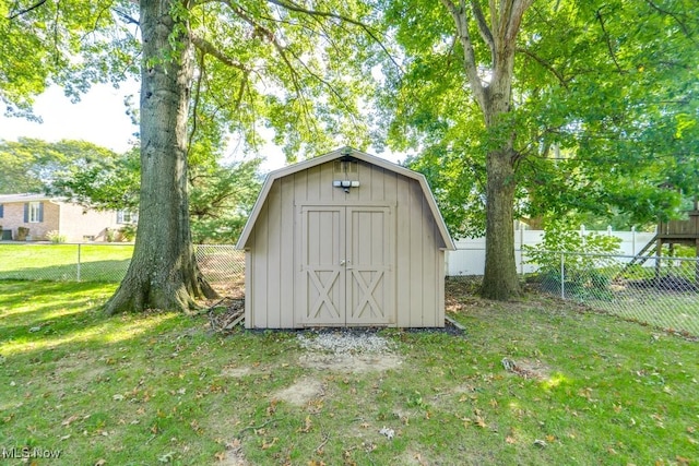 view of outbuilding with a yard